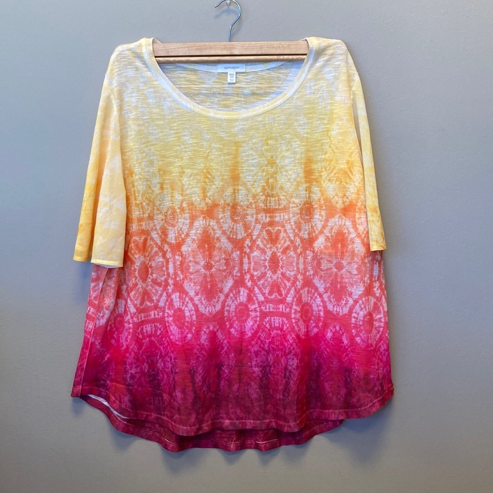 Woman’s blouse like new. Red pattern color’s faded into yellow’s with gemstone.